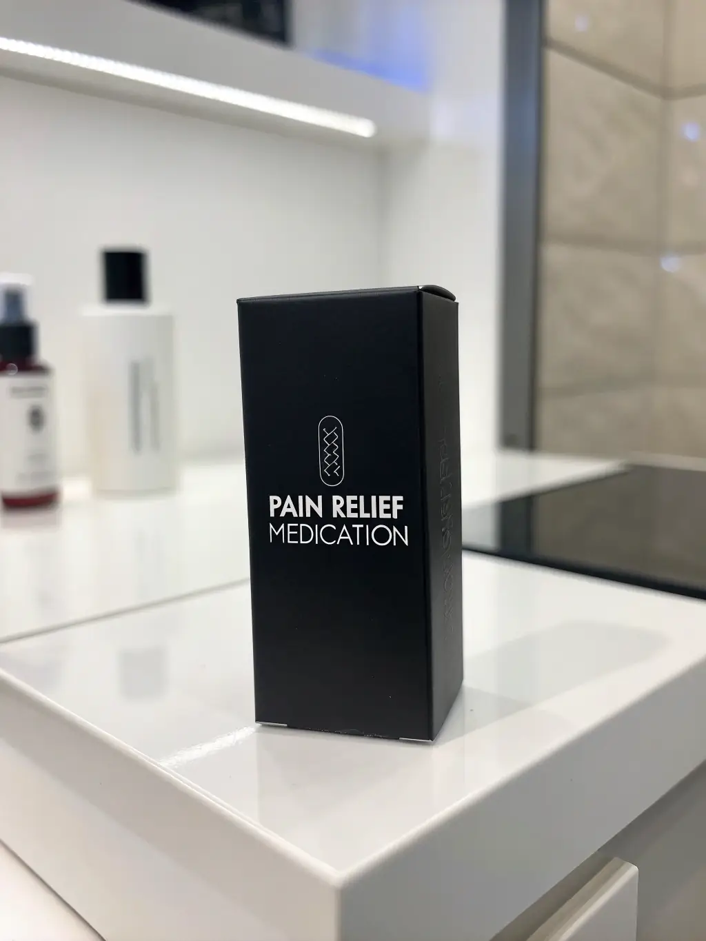 A close-up shot of Amanah Pharmaceuticals' generic pain relief medication packaging, emphasizing the brand logo and clear labeling of ingredients and dosage.